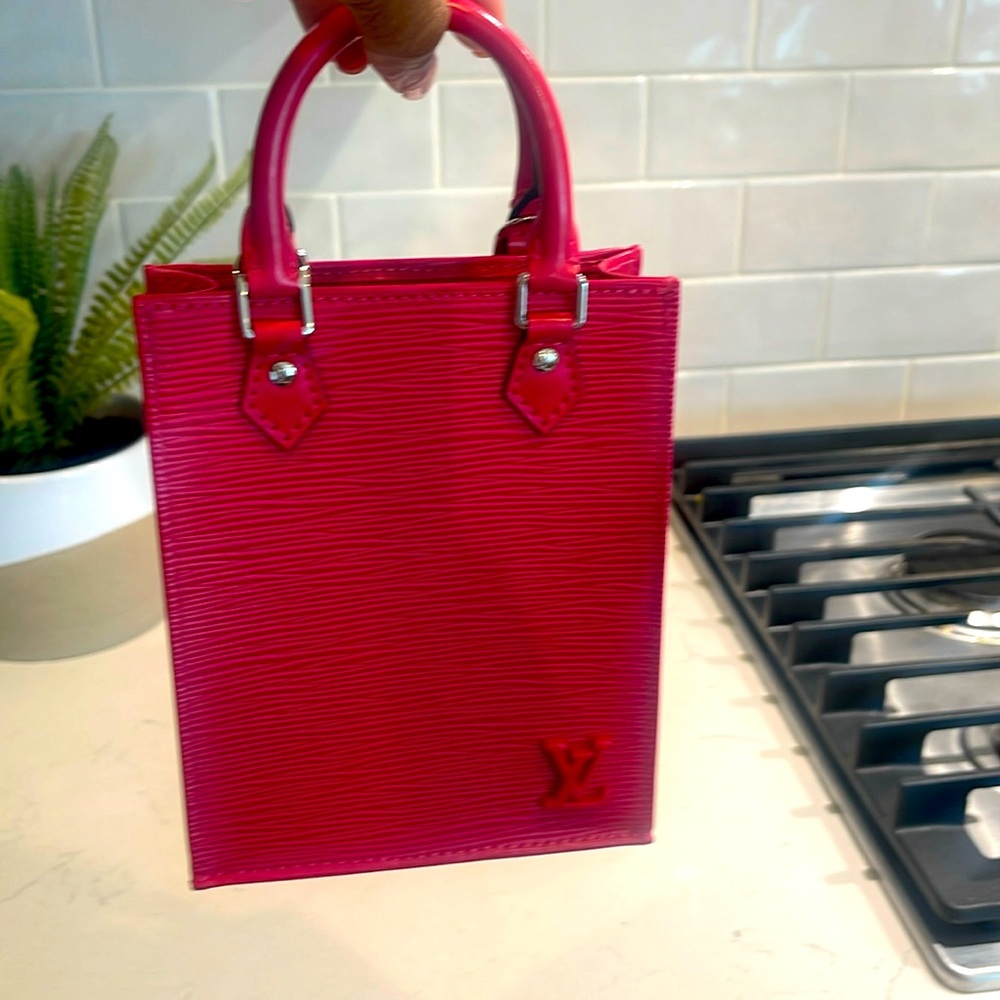 Worn once beautiful Fuschia pink bag hand held or cross body